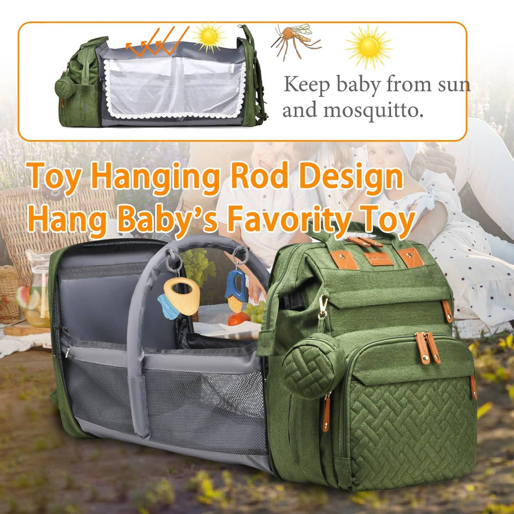 Green diaper bag with hanging toy organizer pouch and open changing compartment