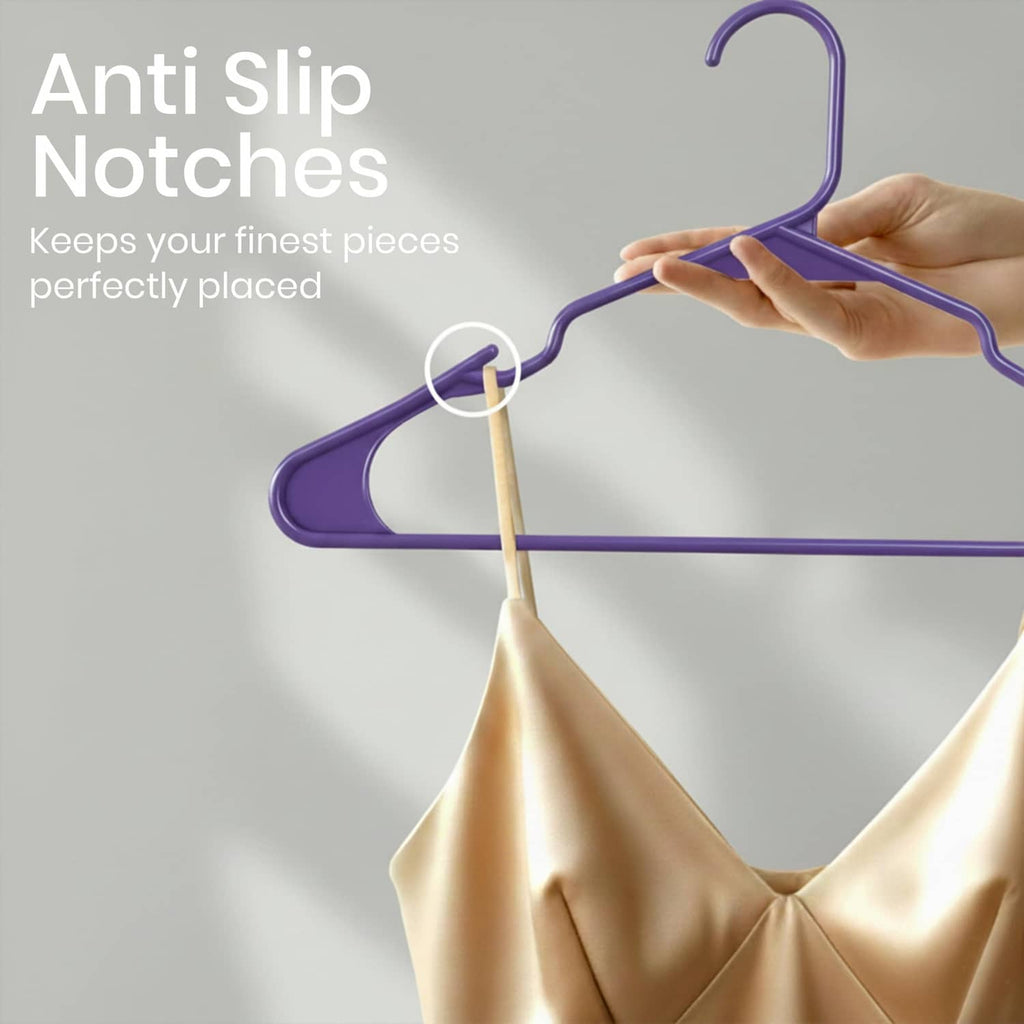 Purple plastic clothes hanger with anti-slip notches on the shoulders