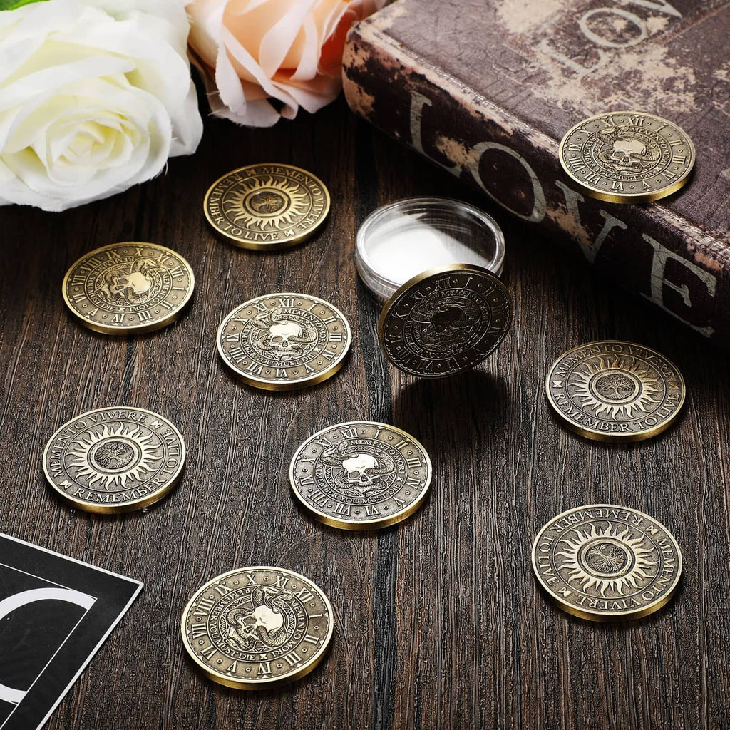 Copper memento mori coins scattered on a dark wood surface