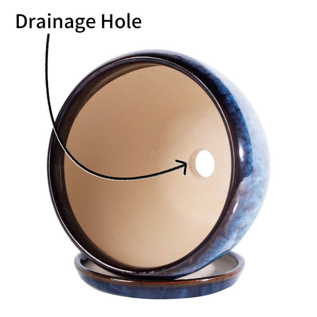 Blue glazed ceramic planter pot bottom view with drainage hole