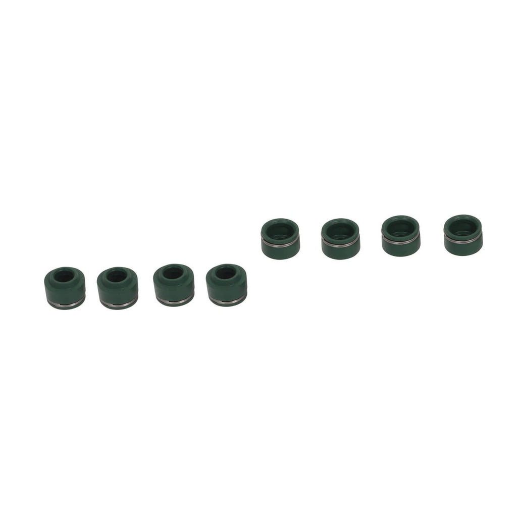 Set of small green-topped valve stem seals in multiple pieces