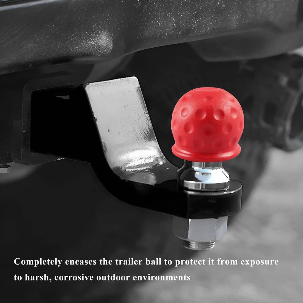 Close-up of red rubber trailer hitch ball cover fitted over a chrome hitch ball