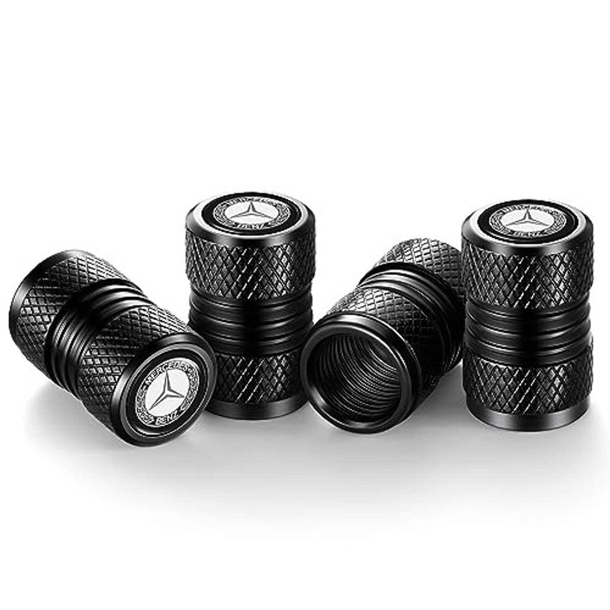 Four black valve stem caps with diamond texture and Mercedes-Benz logo on top