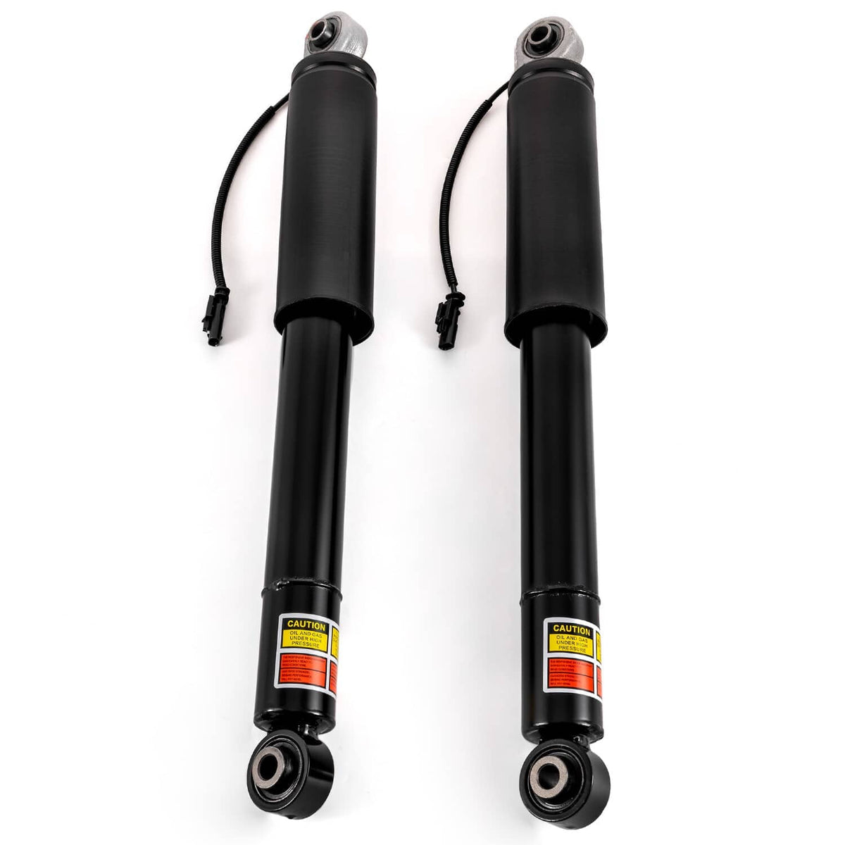 Black rear shock struts with caution labels, top stems, and bottom rubber bushings