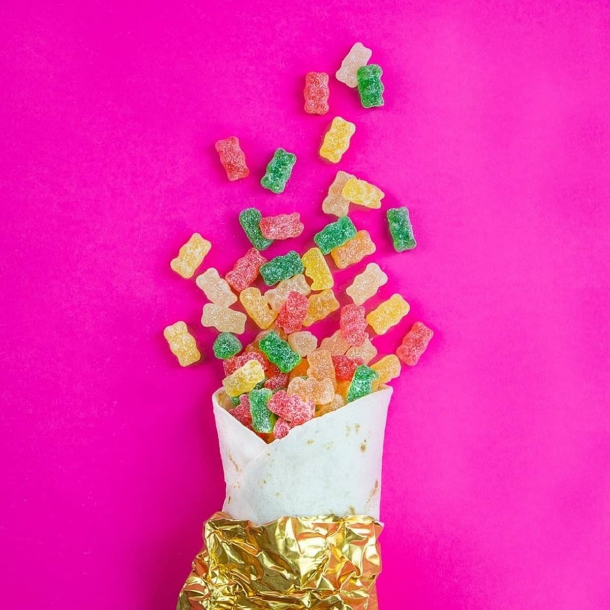 Cup filled with assorted sour gummy bear candies