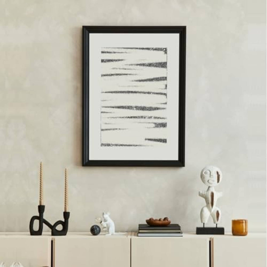 Black picture frame with front glass, slim border around a minimalist print