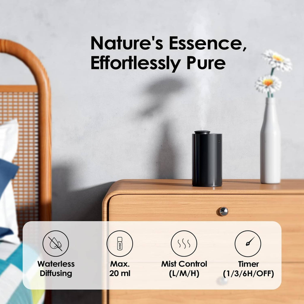 Black waterless diffuser on a wooden surface with circular control panel