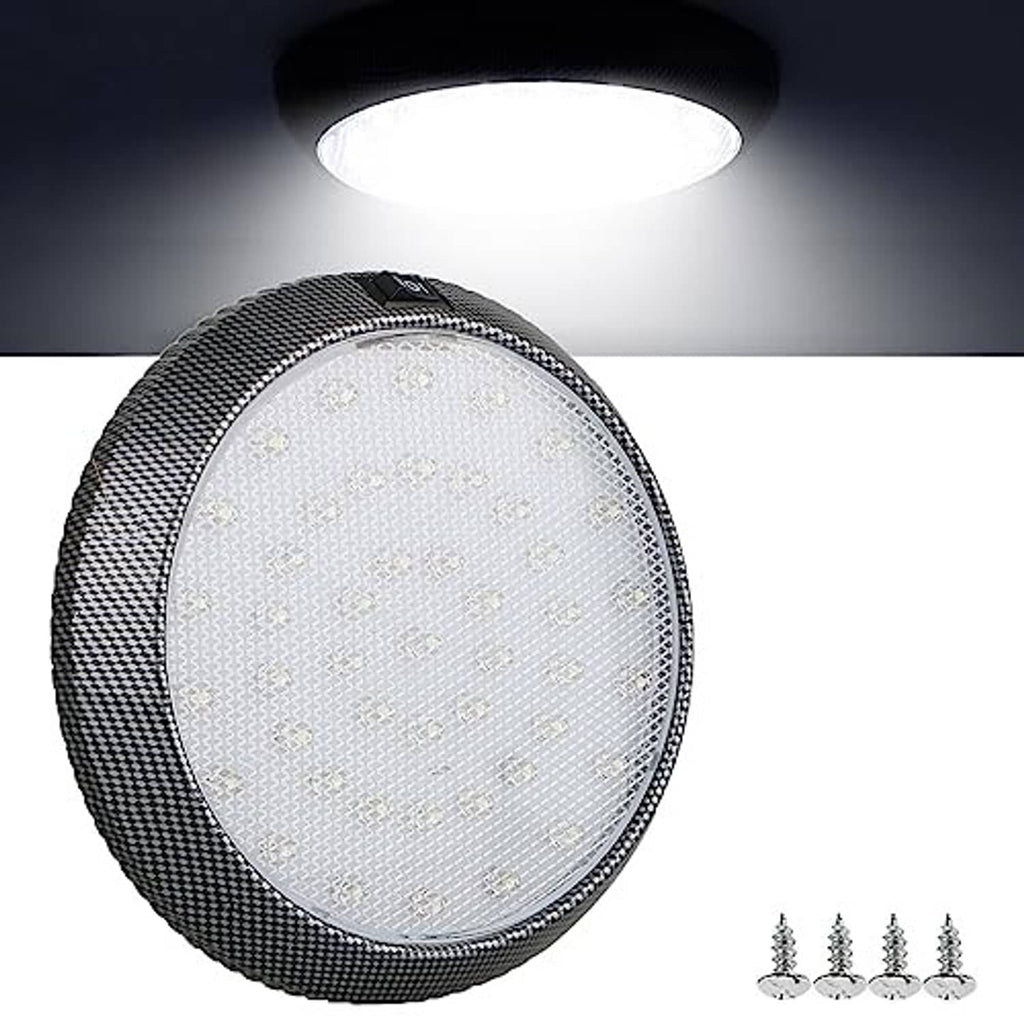 Round black LED dome light with clear lens and textured edge, glowing white