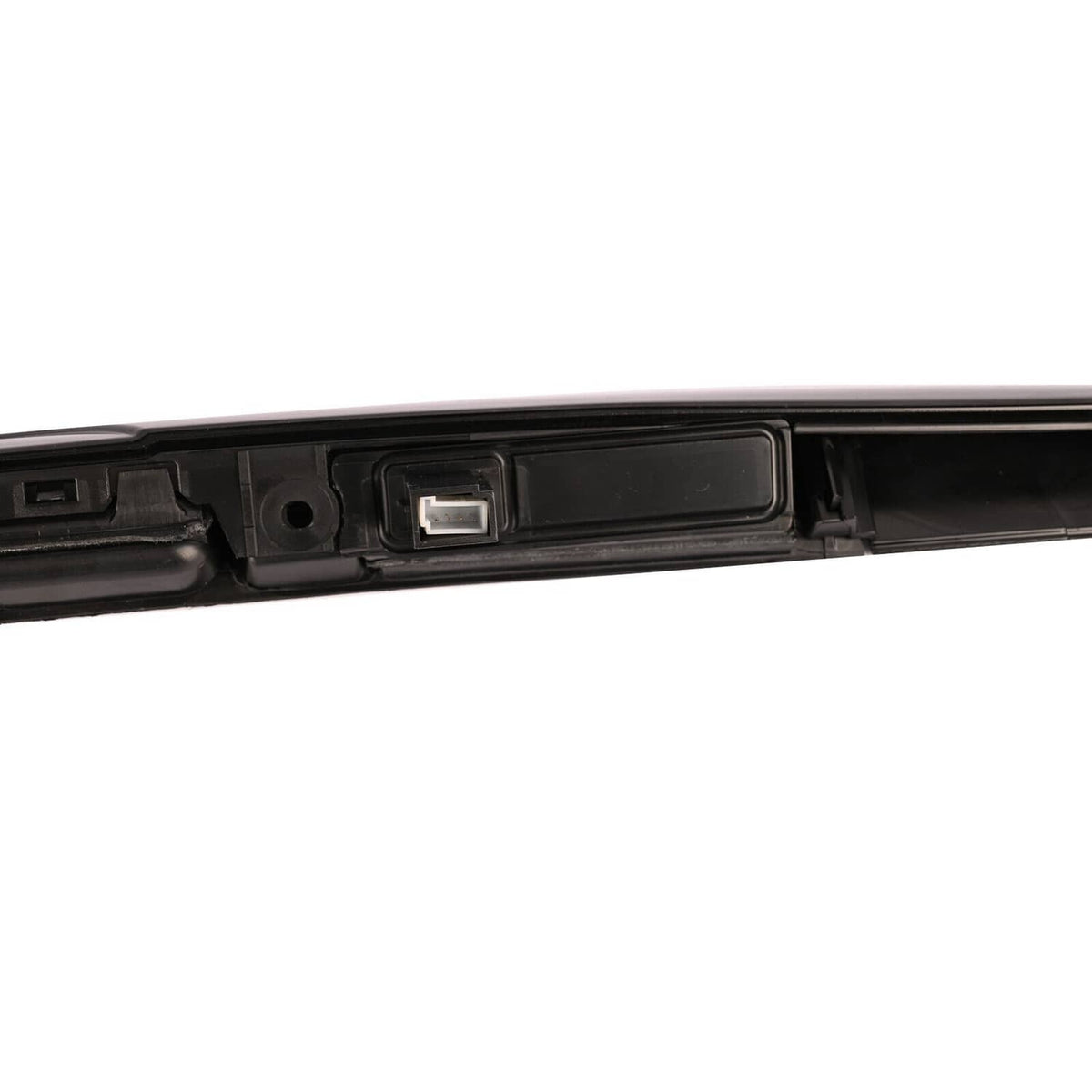 Black tailgate grip handle trim close-up of central light module and mounting slot