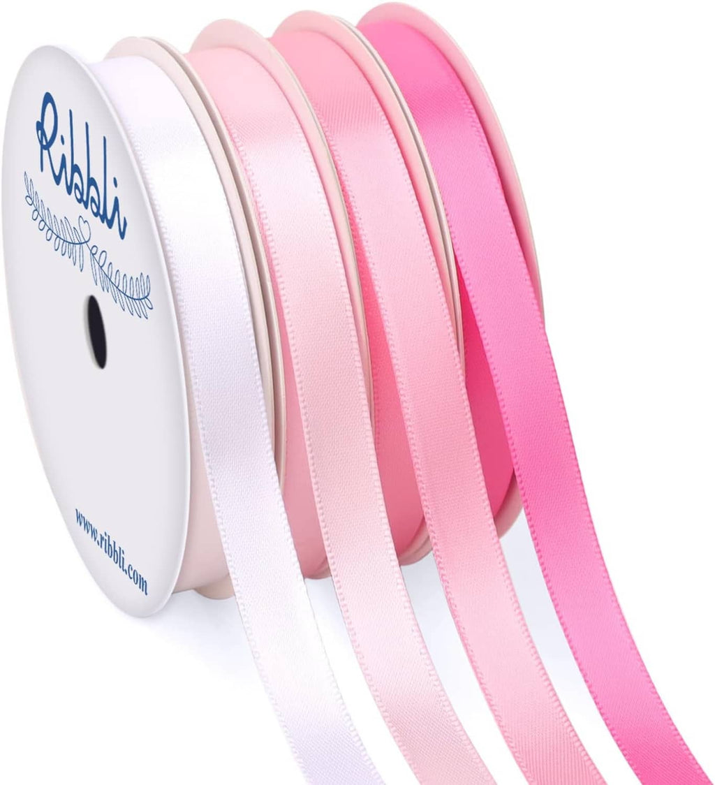 Pink satin ribbon spools with multiple rolls showing smooth satin texture