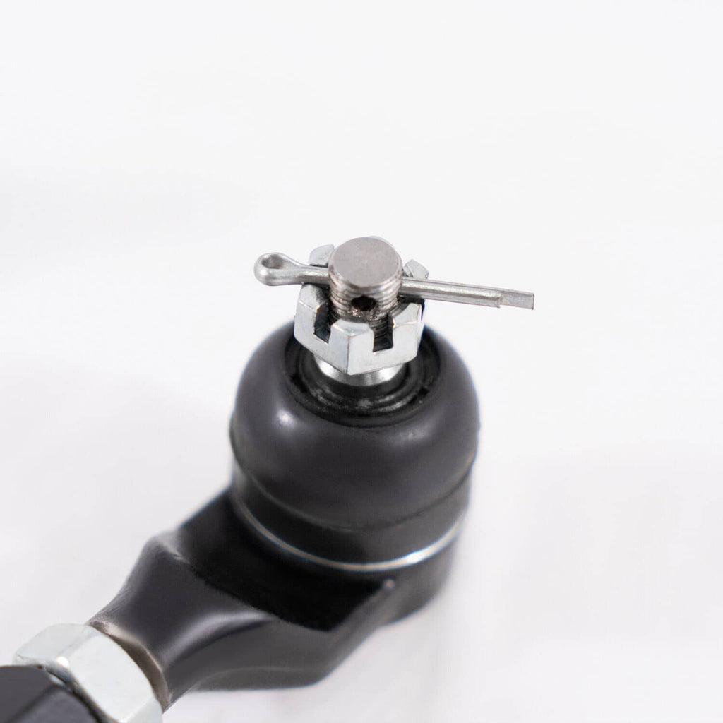 Close-up of black rubber camber arm end with metal ball stud and mounting bolt