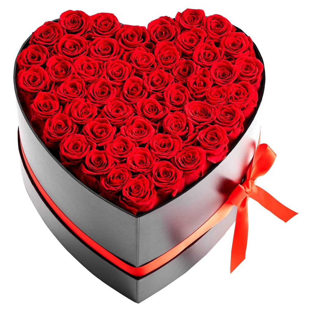 Heart-shaped preserved rose box with dense red roses and red ribbon on black lid