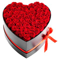 Heart-shaped preserved rose box with dense red roses and red ribbon on black lid