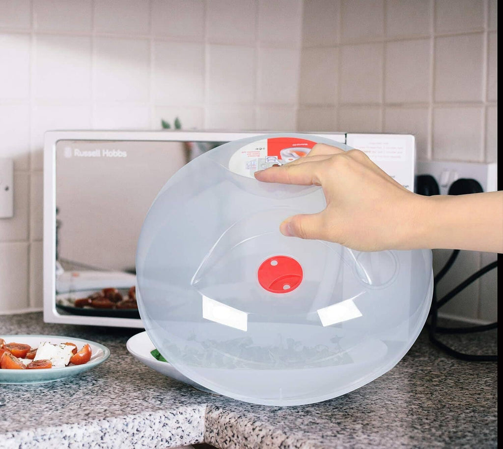 Clear splatter cover dome with red vent center for microwave cooking