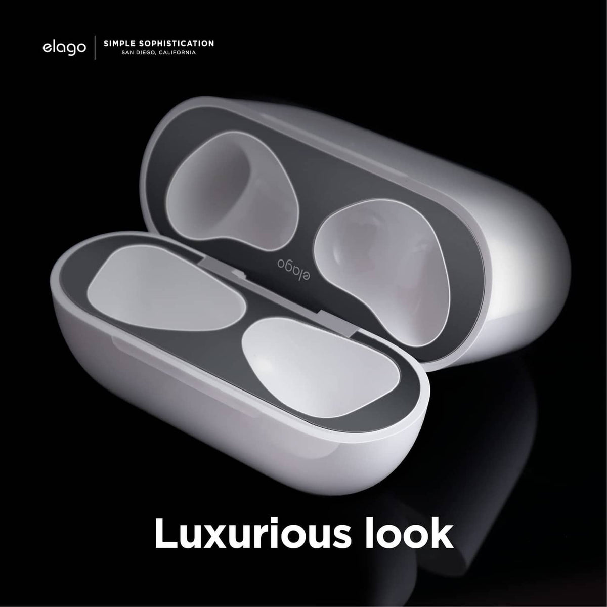 Dark grey glossy dust guard for AirPods charging case with rounded openings for earbuds