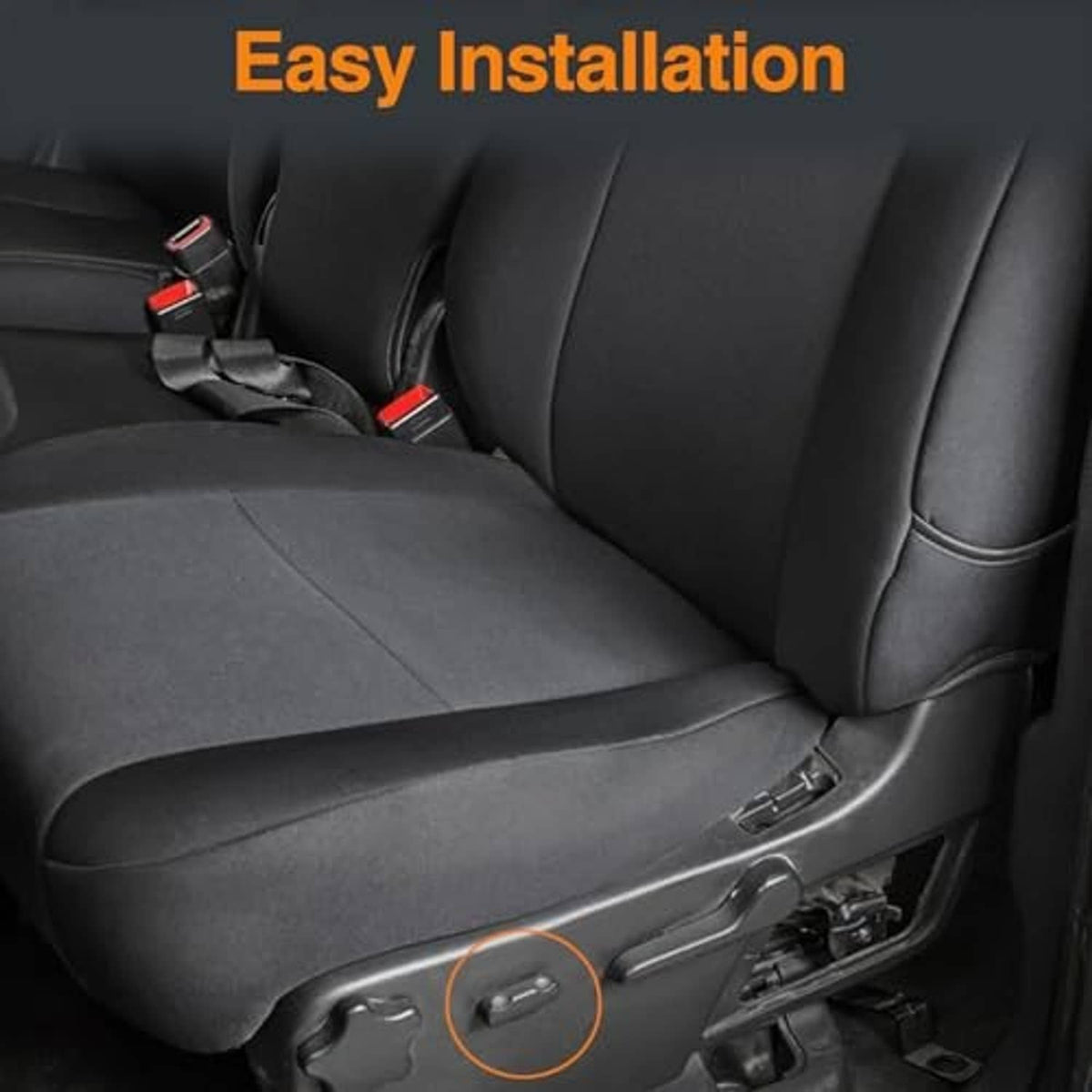 Black car seat side panel with embedded seat adjuster switch near the lever