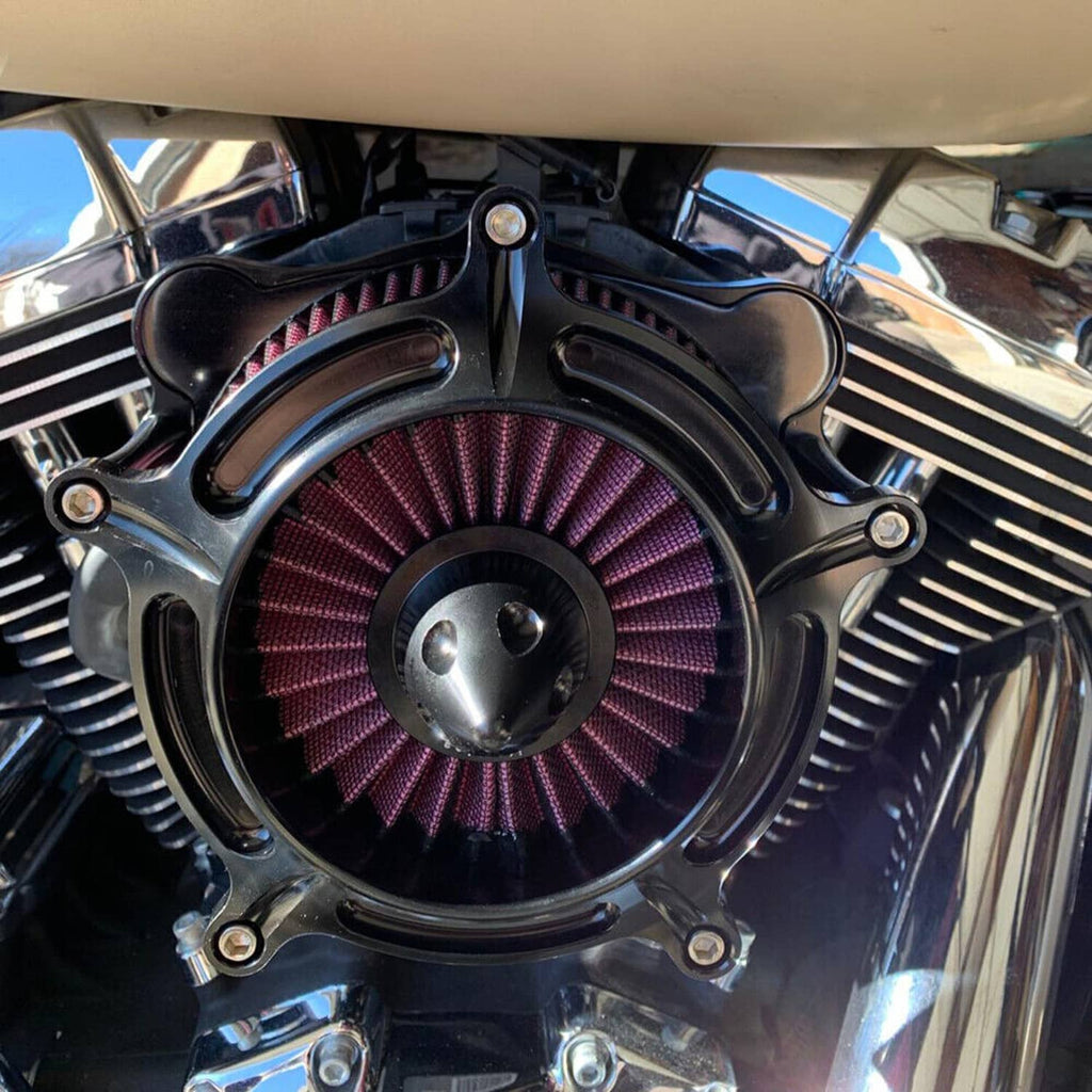 Black air cleaner intake filter with purple-red pleated cones on motorcycle engine