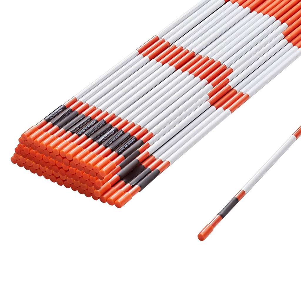Orange-and-white driveway marker stake bundle with pointed ends and black tip caps
