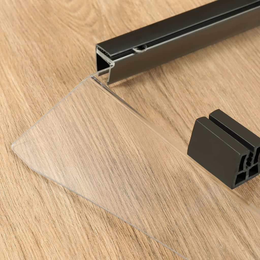Clear windshield panel edge inserted into black support channel