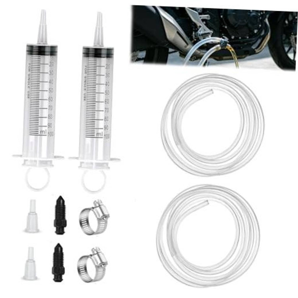 Hydraulic brake bleeding kit with two syringes, clear tubing, and bleed adapters.