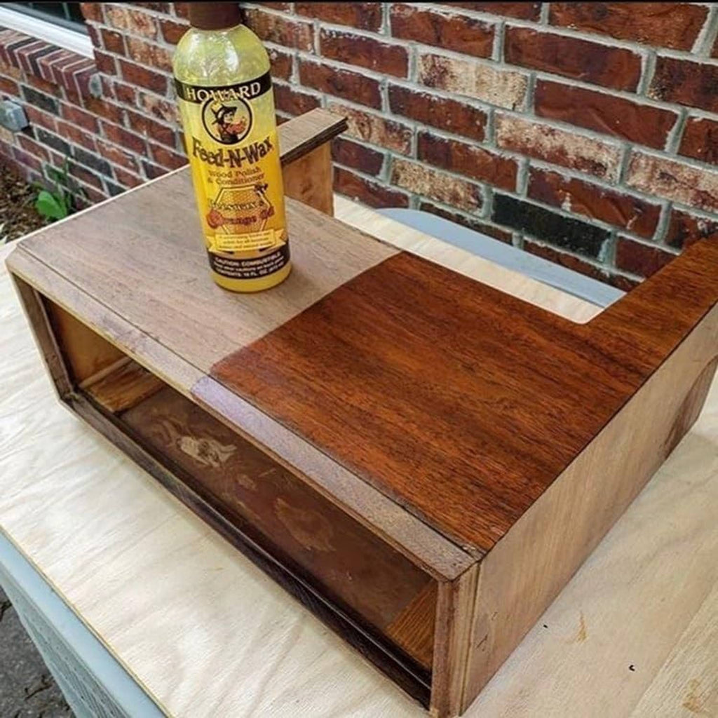 Howard Feed-N-Wax wood polish bottle on wooden table