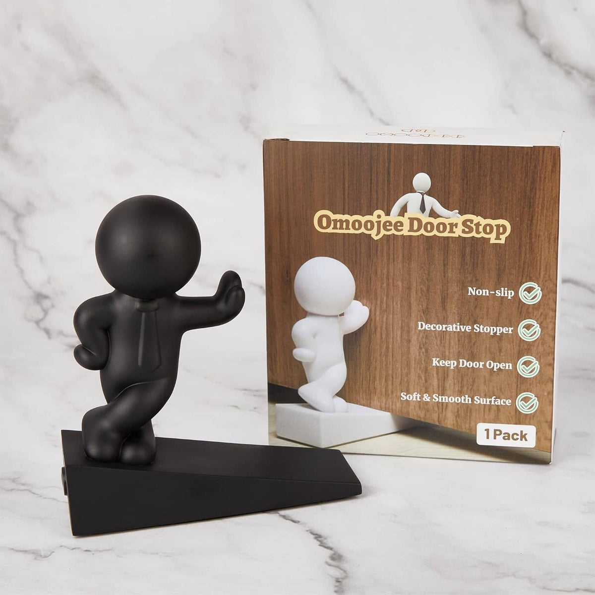 Black character door stop with base, shown next to product box and insert.