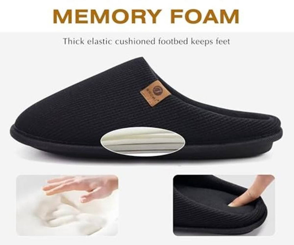 Black memory foam house slipper with cushioned molded footbed and slip-on design.