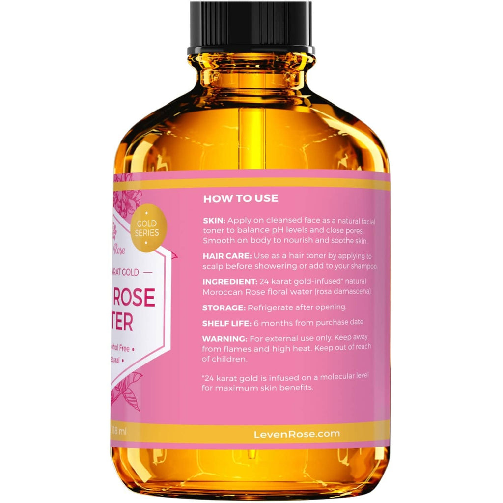 Back view of amber gold rose water toner bottle with pink label, black sprayer top