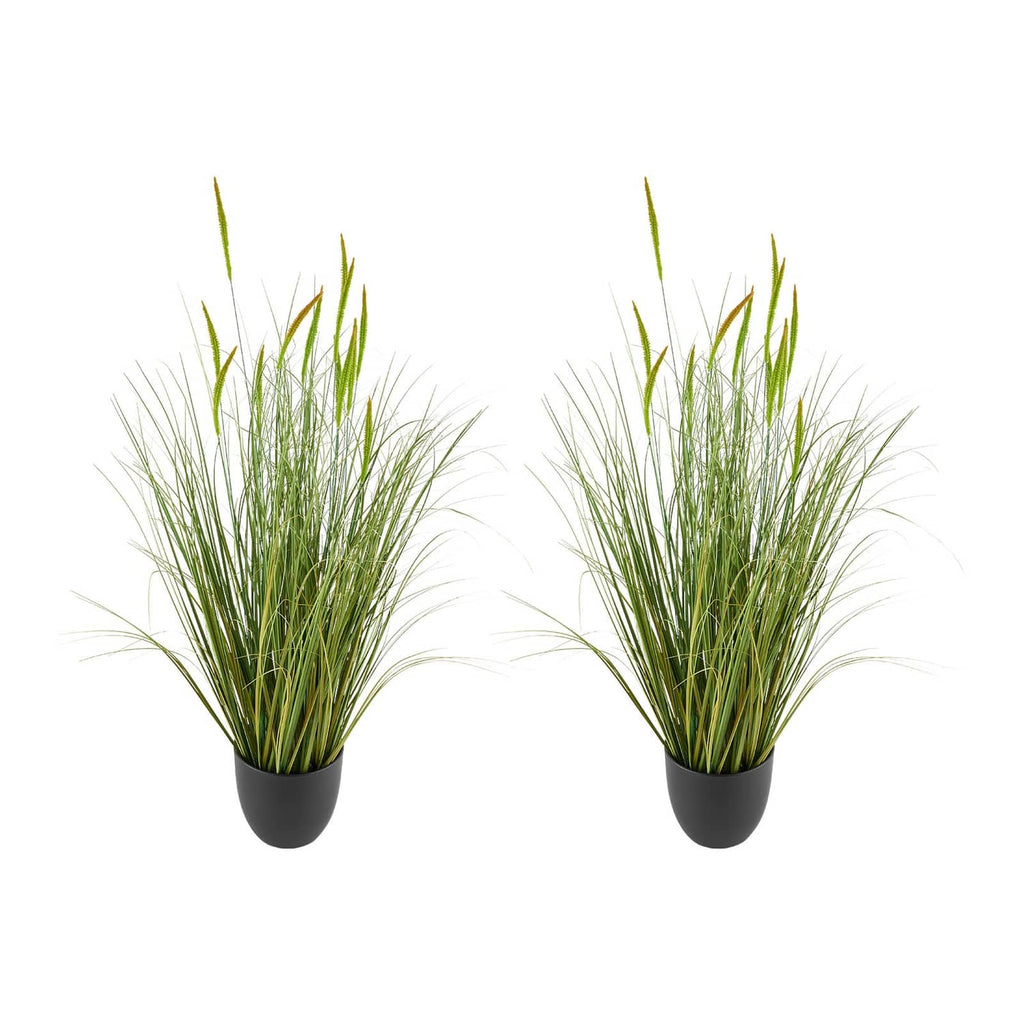 Two black pots holding tall green artificial cattail grass tufts with thin blades