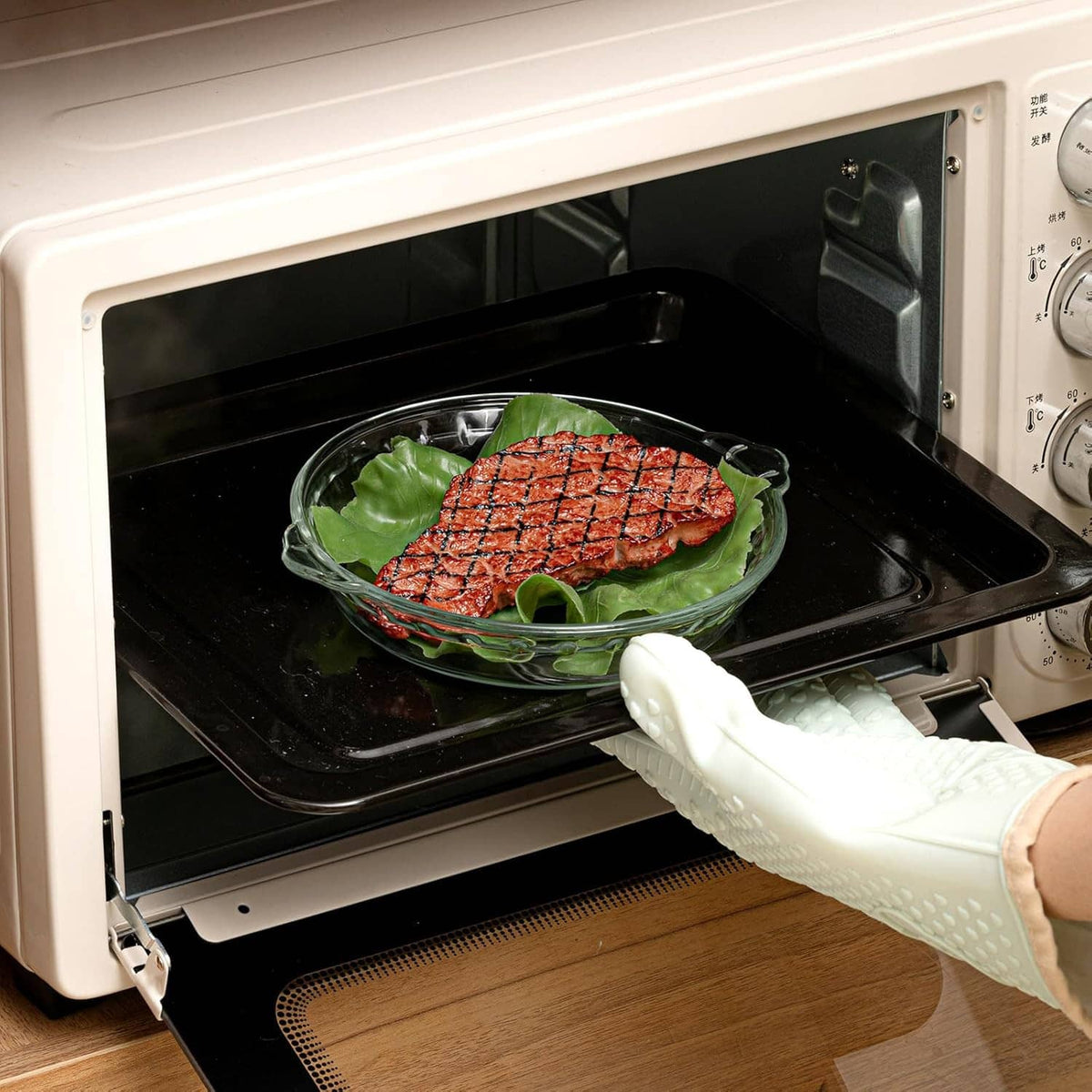 Clear glass pie pan with handles baking in an oven