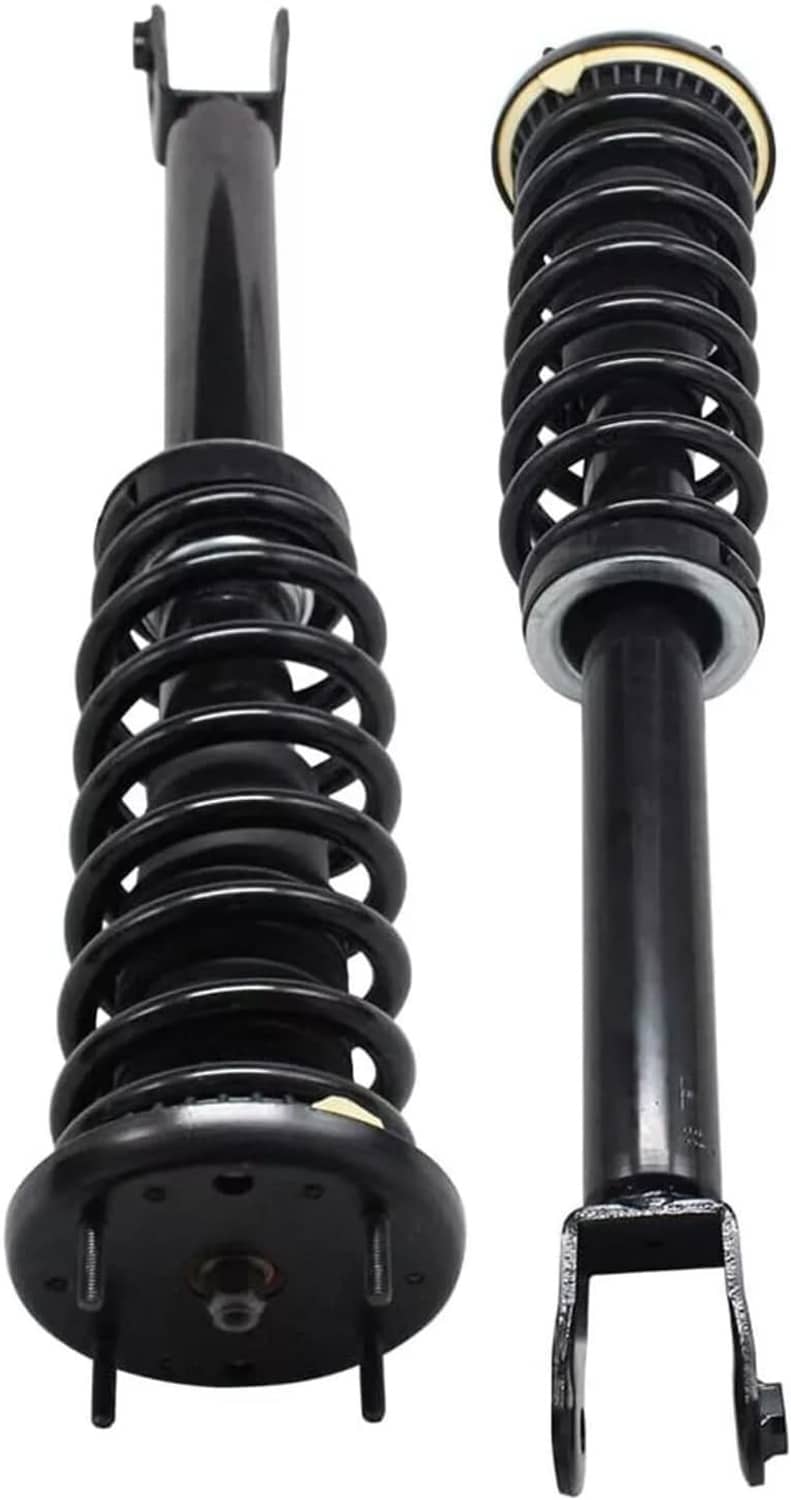 Pair of front shock struts with black springs, top hats, and front fork mounts