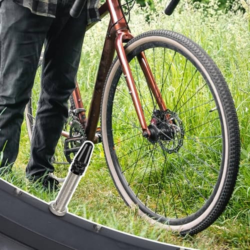 Bicycle wheel with Presta valve stem while inflating using a hand pump