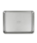 Aluminized steel quarter sheet baking pan with nonstick ridged interior and rim