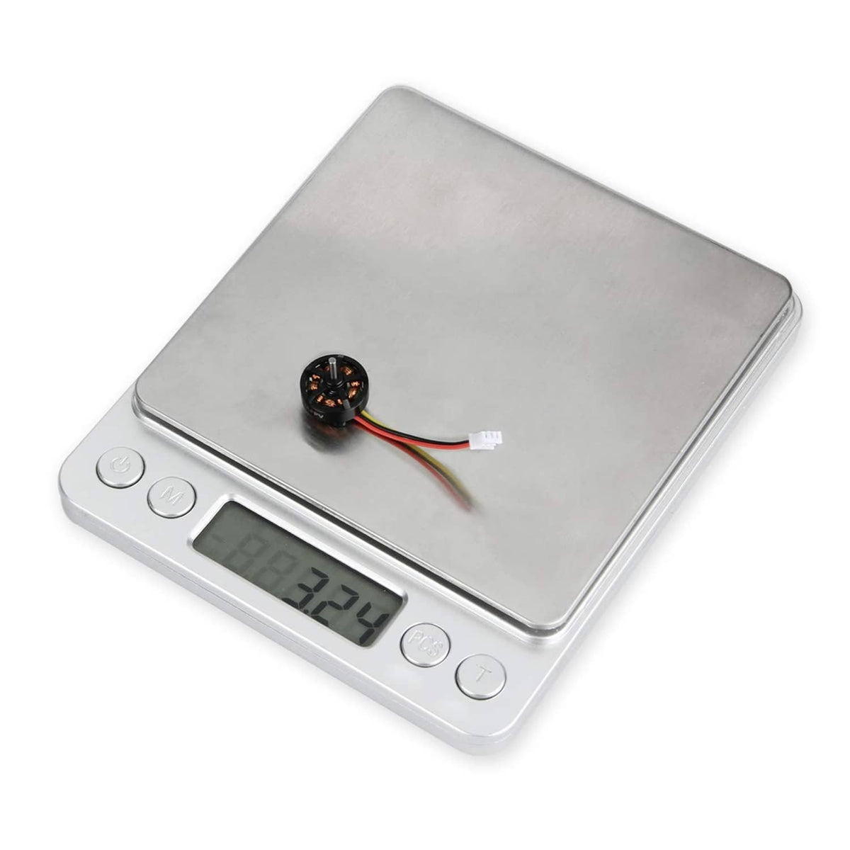 1103 brushless FPV motor on a digital scale, shows weight