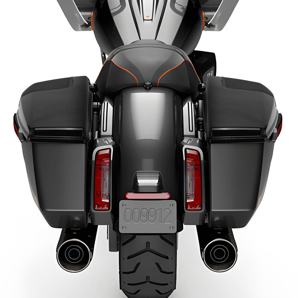 Installed black saddlebag speaker lids with mesh grilles on a motorcycle rear view