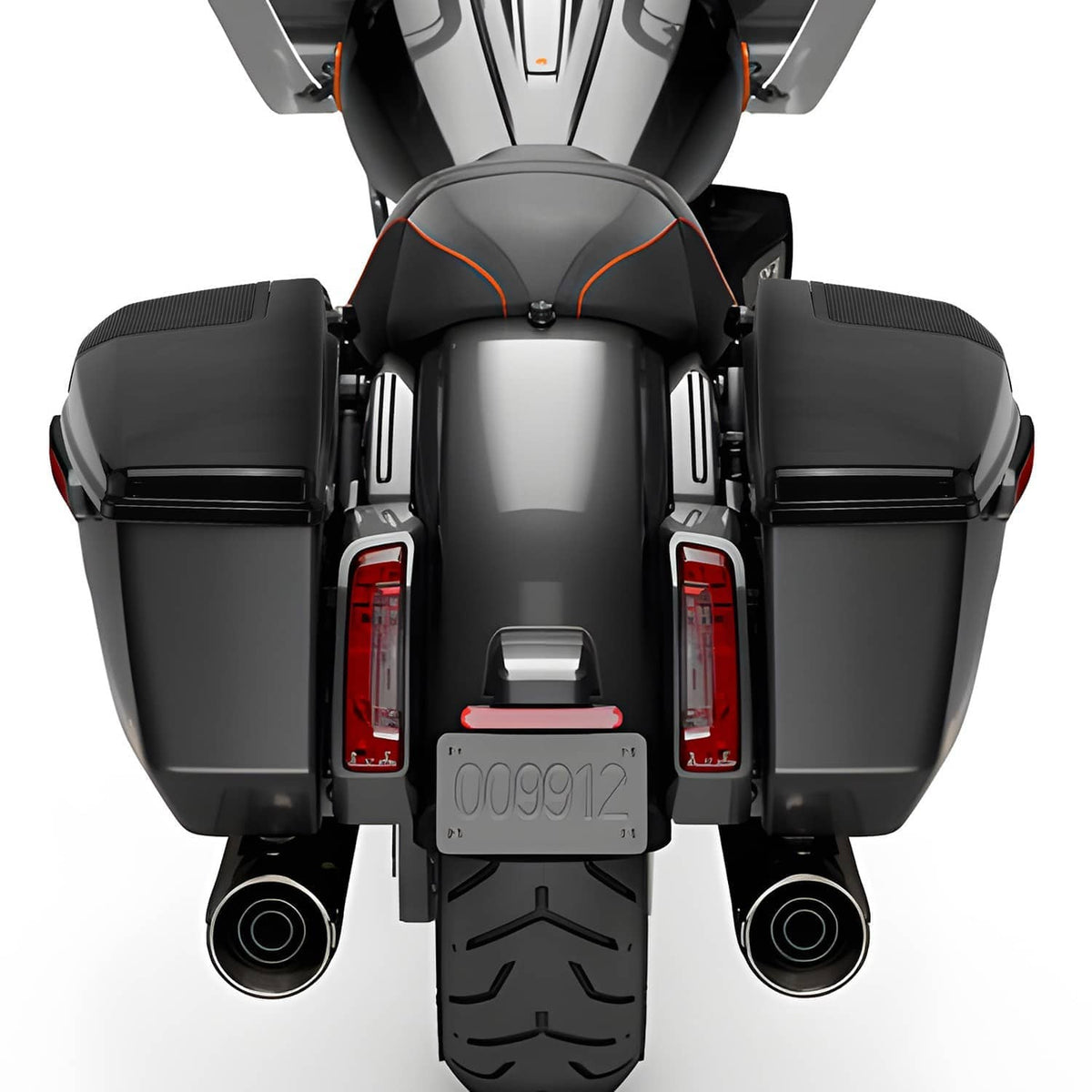 Installed black saddlebag speaker lids with mesh grilles on a motorcycle rear view