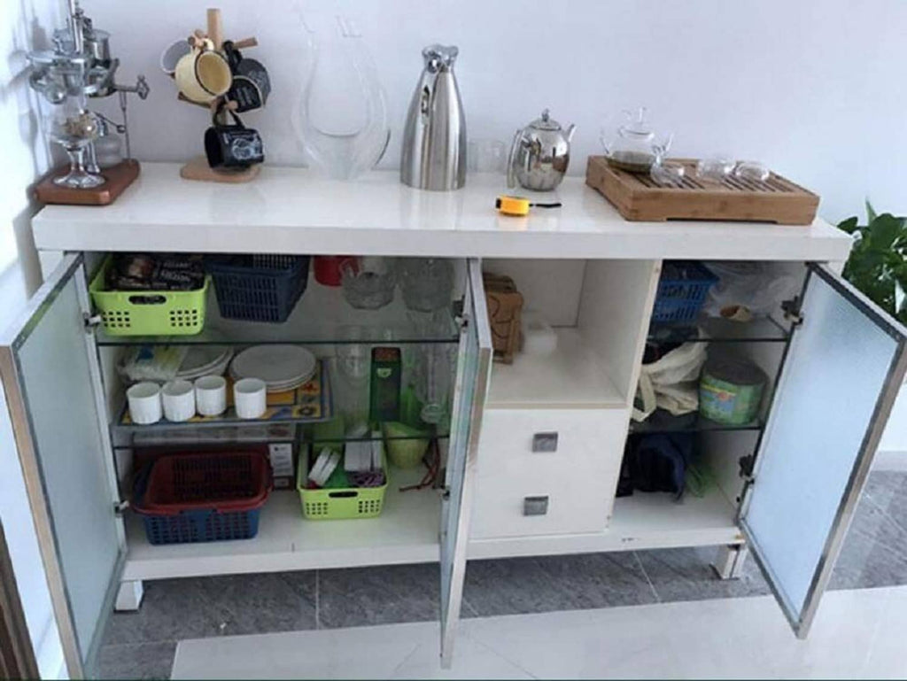 Concealed corner cabinet hinges on open cabinet doors, silver metal hardware