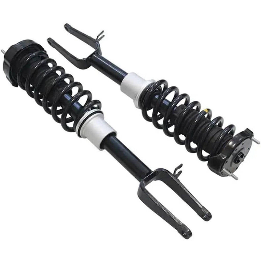 Front shock strut assembly set with black coil springs and silver mounting housings