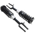 Front shock strut assembly set with black coil springs and silver mounting housings