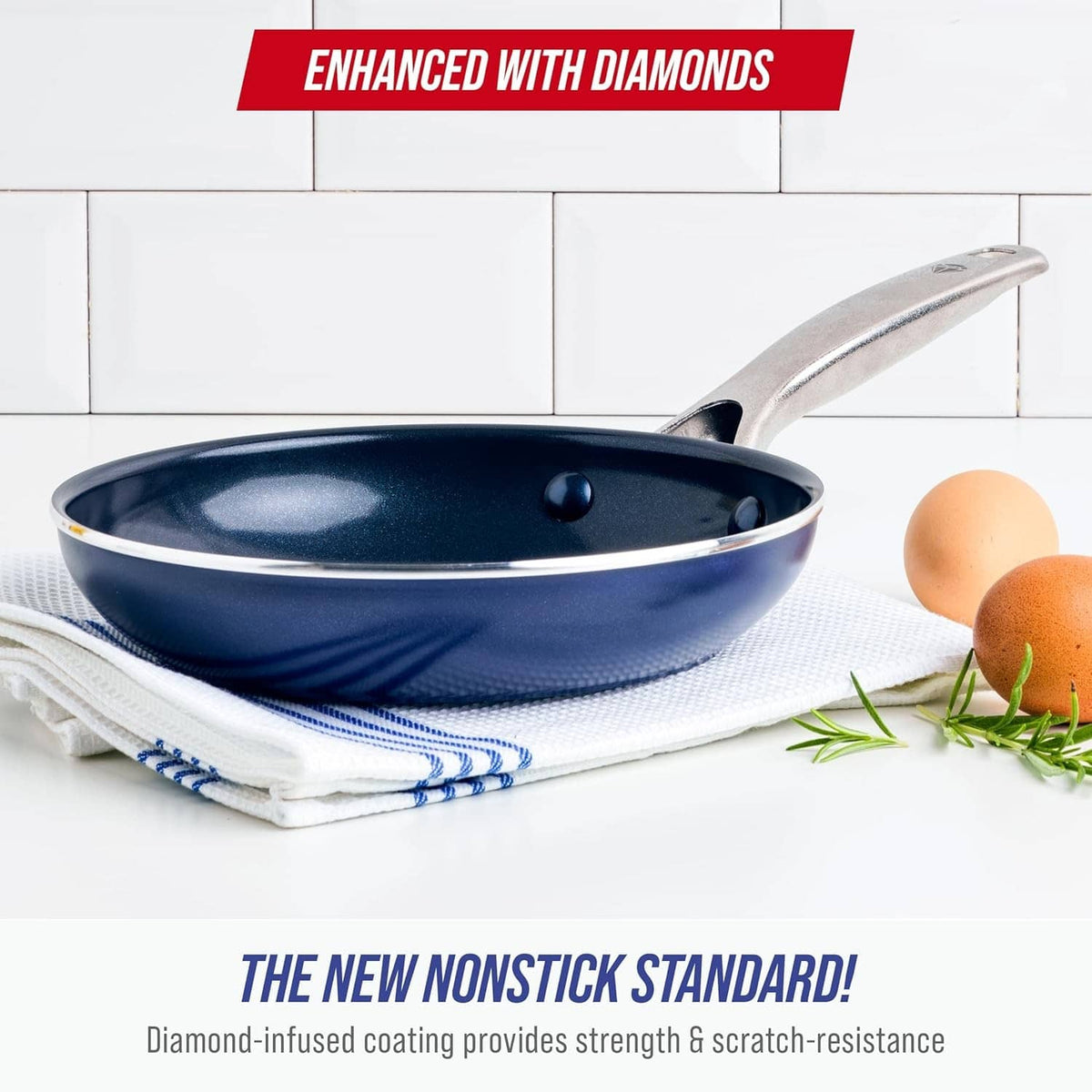Blue ceramic nonstick frying pan on a folded towel with silver side handle