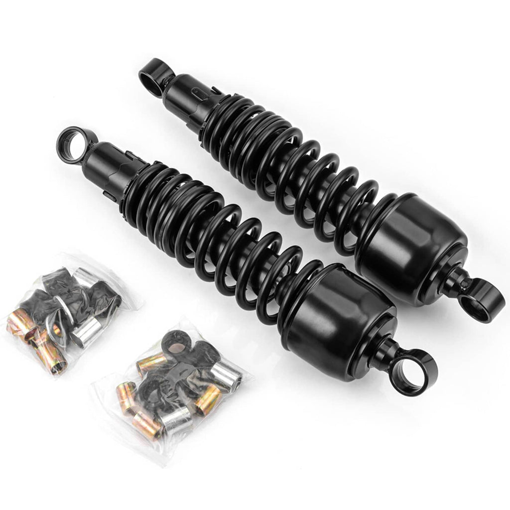 Pair of black suspension shocks with visible spring coils and mounting eye ends