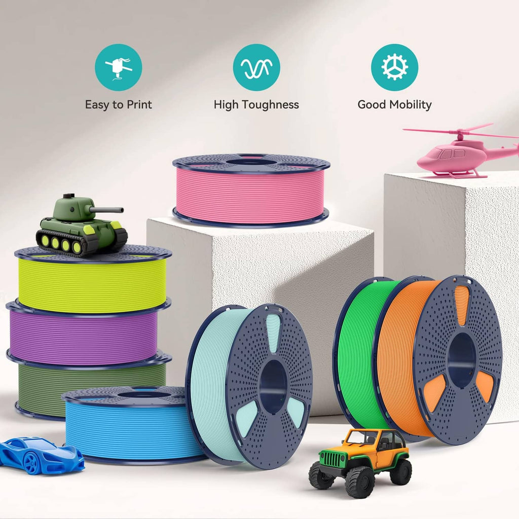 Multiple PLA matte filament spools in assorted colors with toy vehicles around