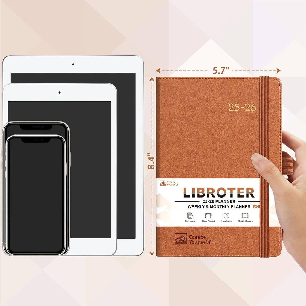 Brown 25-26 planner held up, shows elastic band, 5.7 in width