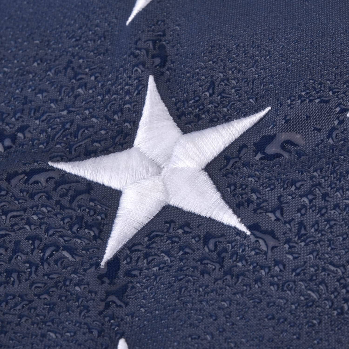 US flag blue fabric with a single white star applique in close-up detail.