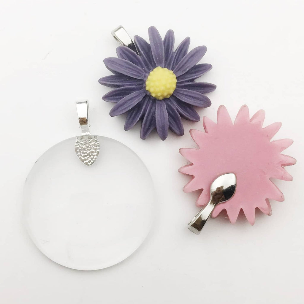 Shiny silver glue-on pendant bails attached to flower-shaped charm tops
