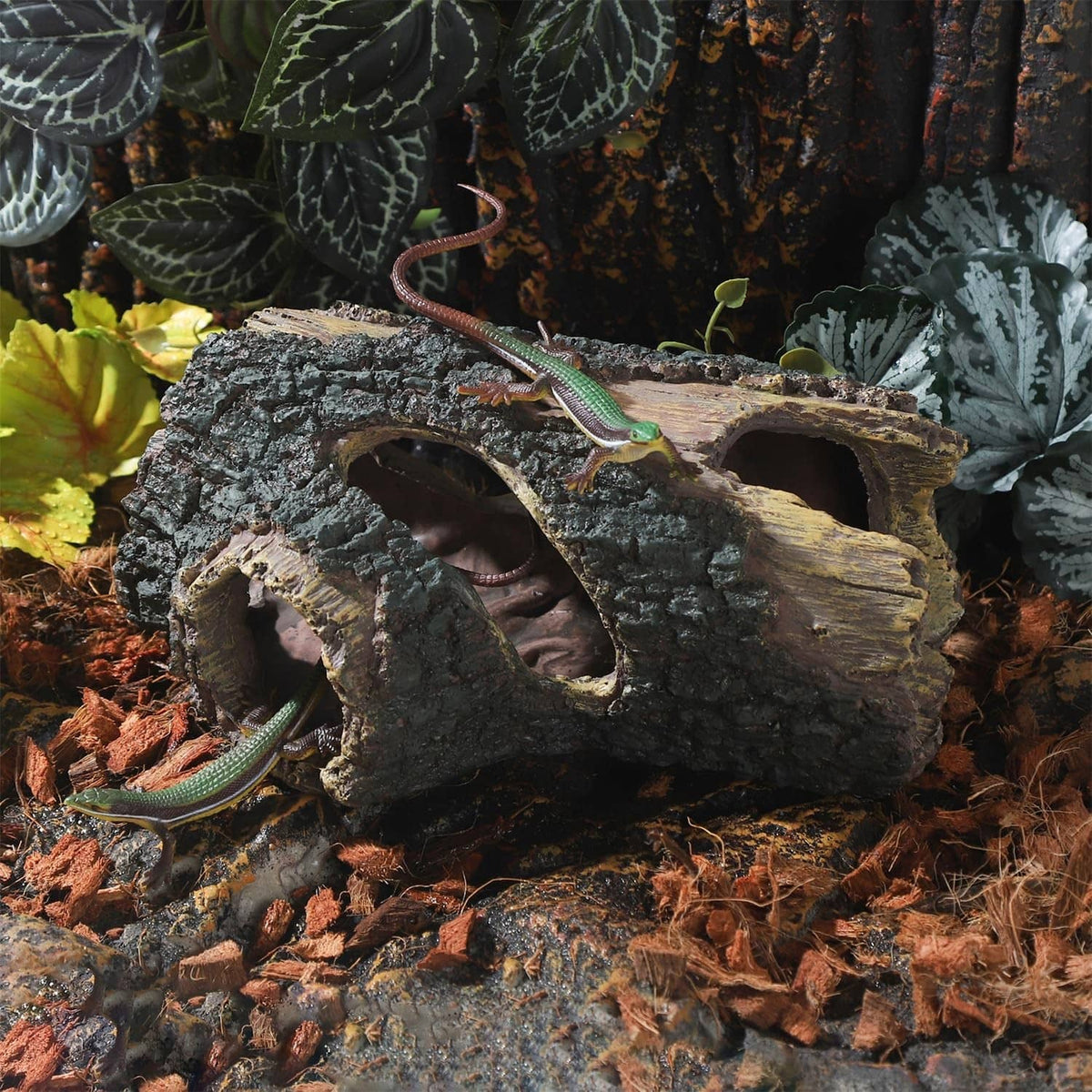 Aquarium log ornament with rugged bark texture and arched cave openings for hiding