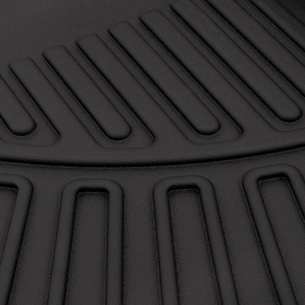 Black TPE floor mat tread pattern with parallel grip channels and raised border.