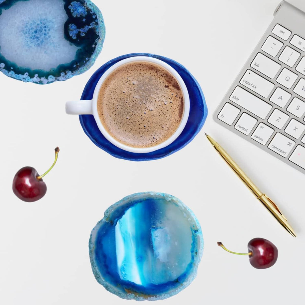 Blue agate geode coasters with one under a cup of coffee on a desk surface