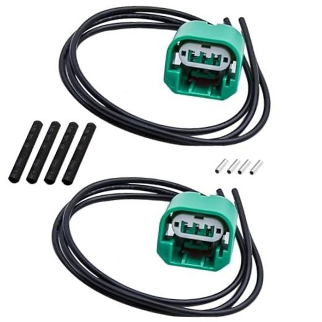 Headlight wiring connector harness with two green plug connectors and black wire leads