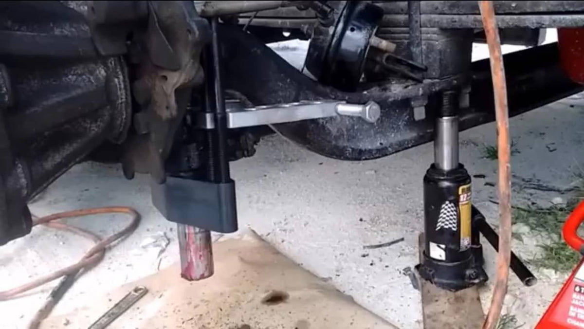 Kingpin press removal tool set up with press posts and adapter sockets